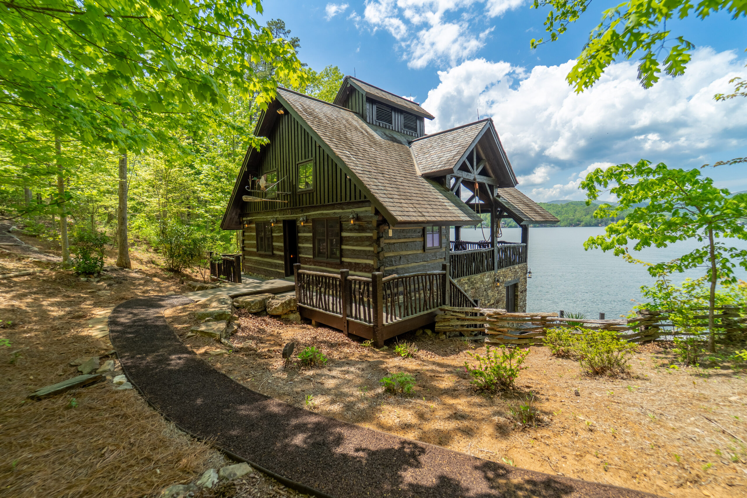 Julie Barnett4 Luxury mountain lodge with stone exterior and covered porch on Lake Burton private island