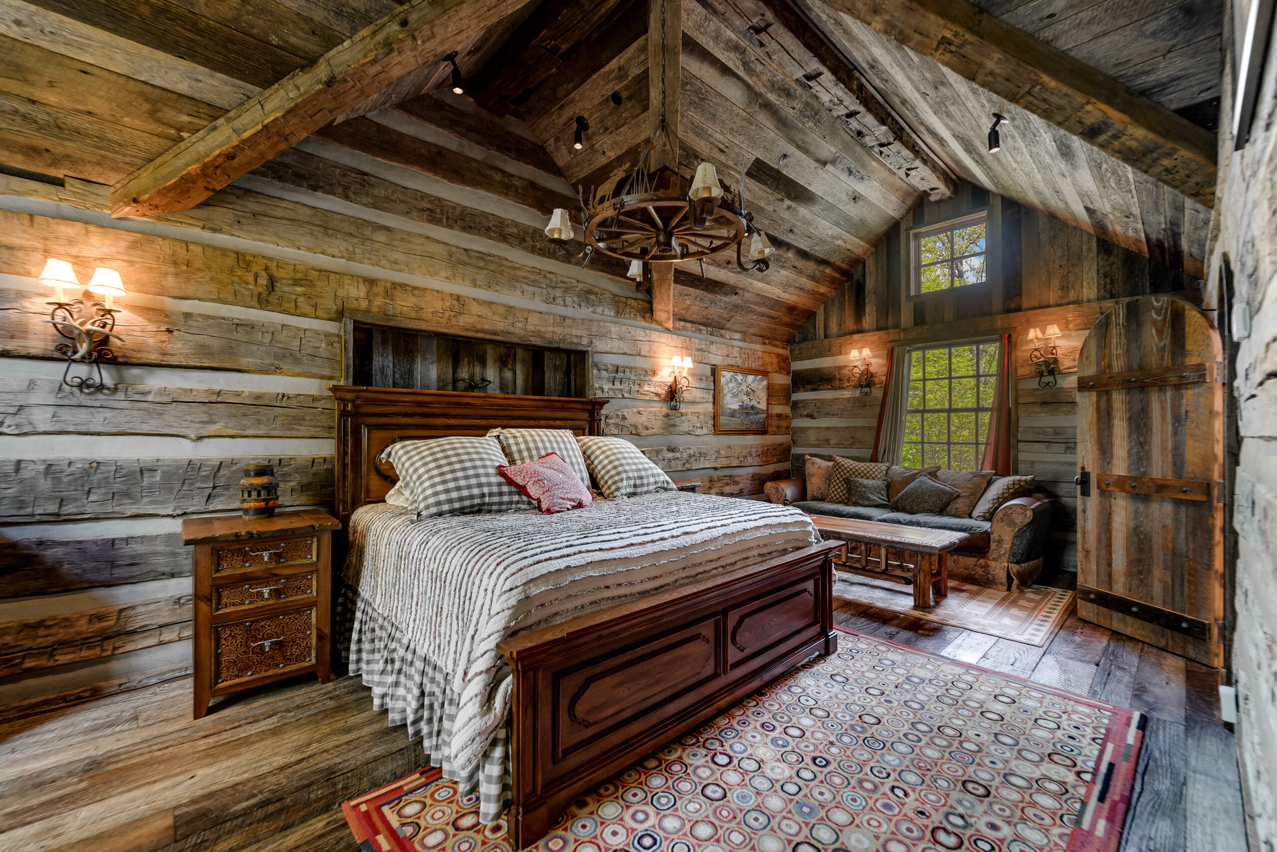 Julie Barnett5 Cozy bedroom with wood beams and large bed Lake Burton private island home