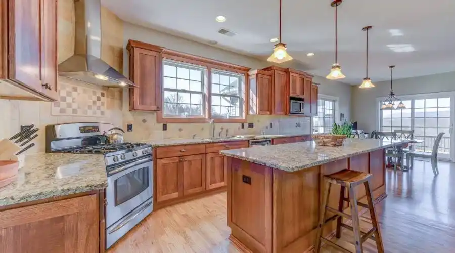 Granite Counter. Tile Backsplash. Stainless steel appliances.