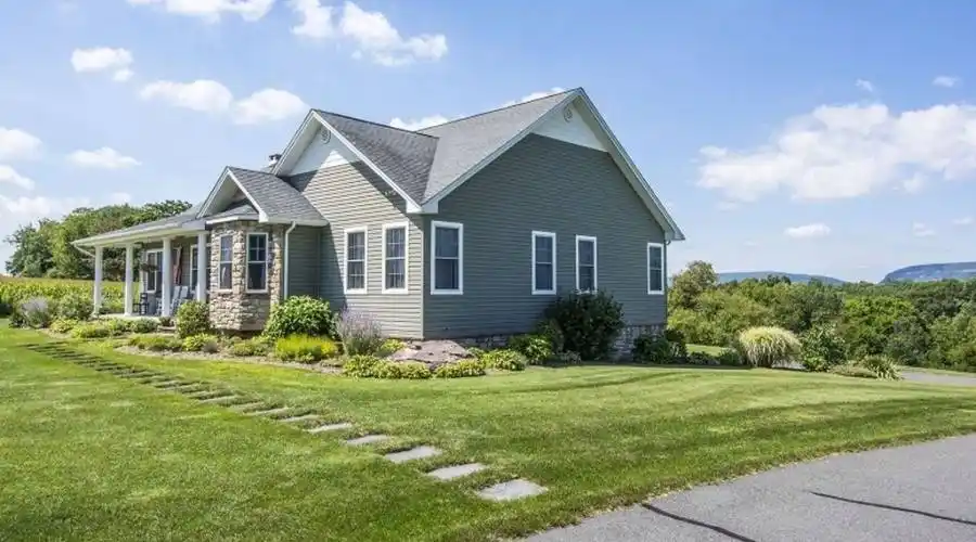 With a 3-Bay Double Deep Heated Garage