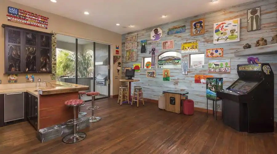 This room shares a bar with the grand room.  Beautiful onyx bar with in counter lighting, refrigerator and icemaker.