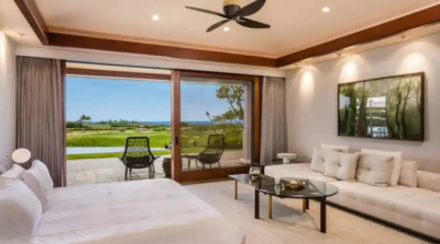 Master bedroom enjoys stunning ocean views and features a secondary sitting area.