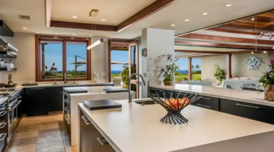Spacious kitchen designed with entertaining in mind provides top of the line stainless steel appliances, dual counter top islands, and a large bar seating area off the great room.
