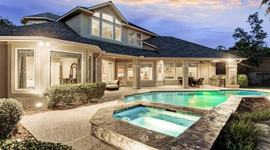Pool, Spa, covered Patio and Outdoor Kitchen expand the list of home features