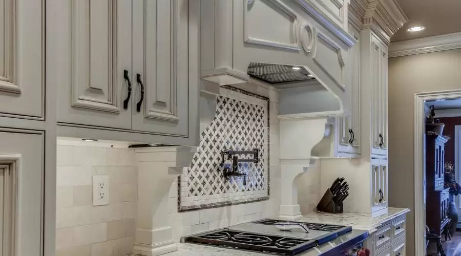 Hand-Crafted Cabinetry. Cabinet-Veiled Dual Sub Zero frig, Broan Compactor. Bosch Microwave. Viking Wine Cooler. Miele Built-In Expresso Maker. 9-Tier Custom Moldings.