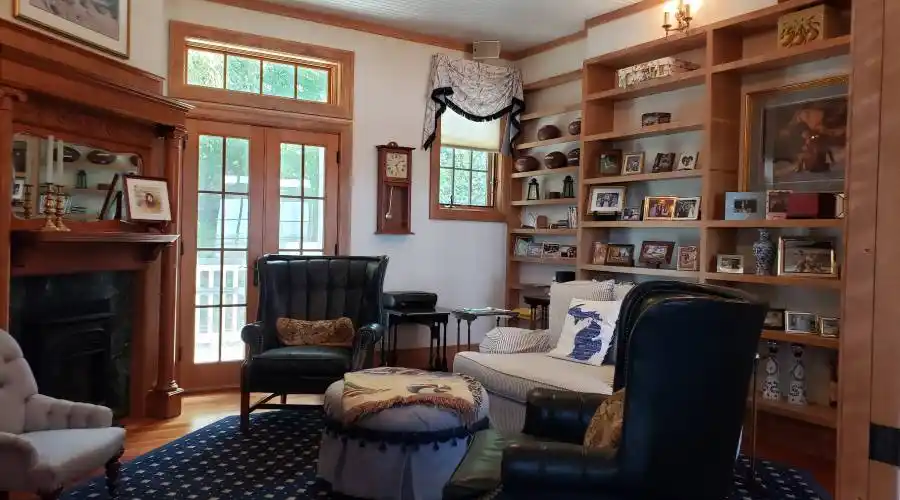 Library/TV room with fireplace